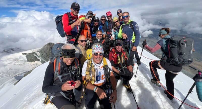 Il team del progetto “Alpinisti insuperAbili” in vetta al Breithorn lo scorso anno con Egidio Marchese